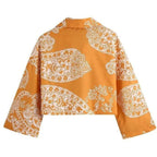 orange paisley print ruched top and high waist skirt