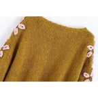 pink embroidered sweater
