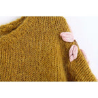 pink embroidered sweater