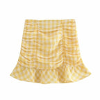 one shoulder crop top and plaid ruched skirt