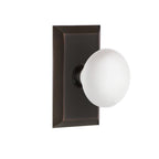 Studio Plate 2-3/8 in. Backset Timeless Bronze PassaHall/Closet White Porcelain Door Knob