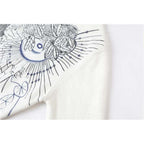 white embroidered sweater