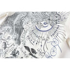 white embroidered sweater
