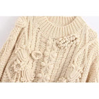 beige criss-cross sweater