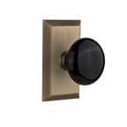 Studio Plate 2-3/4 in. Backset Antique Brass PassaHall/Closet Black Porcelain Door Knob